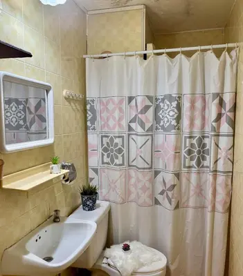 a bathroom with a sink and a shower curtain at Ally home 12 23 in Thung Si Kan