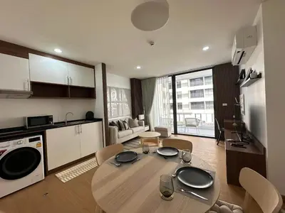 a kitchen and dining room with a table in a room at 6th Avenue Sukhumvit BKK Two Bedrooms BTS Asok Nana MRT Sukhumvit in Bangkok