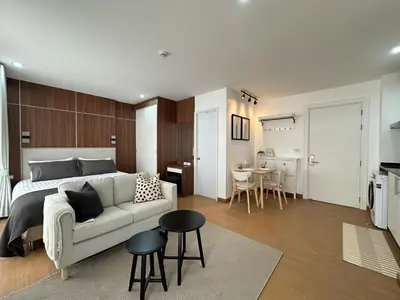 a bedroom with a bed and a couch and a table at 6th Avenue Sukhumvit BKK Two Bedrooms BTS Asok Nana MRT Sukhumvit in Bangkok