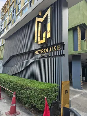 a metrolink building with orange cones in front of it at Metroluxe rama4 , city center in Bangkok