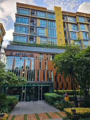 a building with a sign on the front of it at Metroluxe rama4 , city center in Bangkok