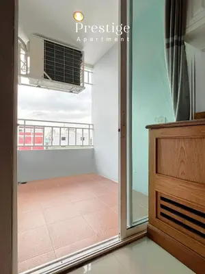 a room with a view of a balcony at Prestige in Bangna