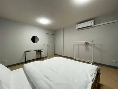 a hospital room with a white bed in it at Ananta House in Bang Su