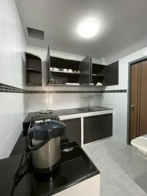 a kitchen with a pot on a counter top at Ananta House in Bang Su