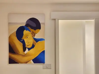 a painting on a wall next to a door at Be Cozy Silom Modern 2BR 1-min to BTS & MRT in Bangkok