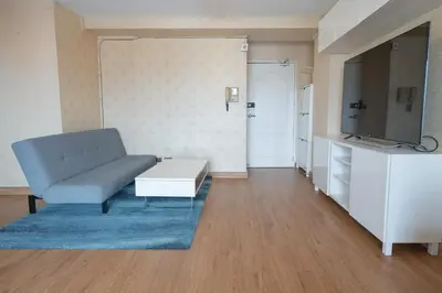 a living room with a couch and a tv at 2Bed Room Condo Near iConsiam & BTS Krungthonburi in Bangkok