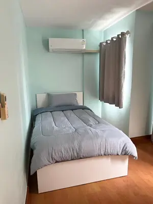 a bedroom with a bed and a air conditioner at 2Bed Room Condo Near iConsiam & BTS Krungthonburi in Bangkok
