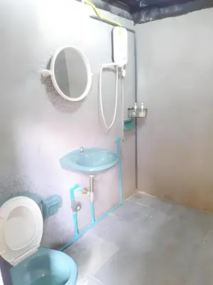 a bathroom with a blue toilet and a sink at xx GO INN The Grand Palace - โก อินน์ วัดพระแก้ว พระบรมมหาราชวัง Pro in Bangkok