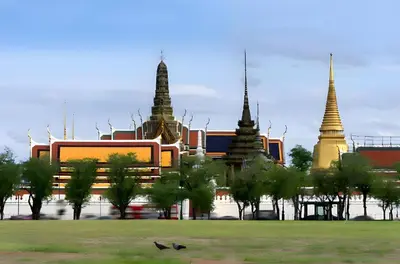 a building with three towers in a park with trees at XX Mitr Inn MRT Samyot - ตรอกวิสูตร MRT สามยอด in Bangkok