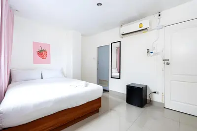 a white bedroom with a bed in a room at XX Oh My Nap Sukhumvit 3 - สุขุมวิท 3 in Makkasan