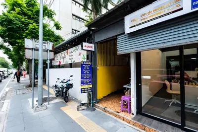 a motorcycle parked outside of a store on a street at XX Oh My Nap Sukhumvit 3 - สุขุมวิท 3 in Makkasan