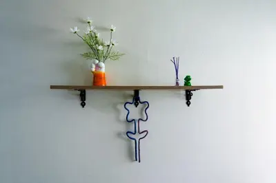 a shelf on a wall with vases on it at Baan ABC at 112 Phahonyothin 55 in Bang Khen
