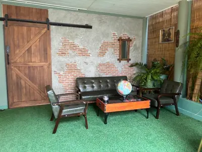a living room with a couch and two chairs and a table at The oasis on 8 City blue 2