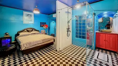 a bedroom with a shower and a bed in a room at The oasis on 8 City blue 2