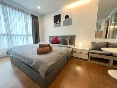 a bedroom with a bed with a teddy bear on it at Private Comfy Near BTS&MRT Sukhumvit Minimum 14 nights in Bangkok