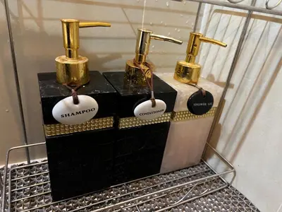 a black and gold appliance with four valves on it at Private Comfy Near BTS&MRT Sukhumvit Minimum 14 nights in Bangkok