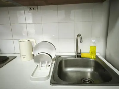 a kitchen counter with a sink and a toilet at Condo 1B1BR Sukhumvit 103 BTS Udomsuk in Phra Khanong