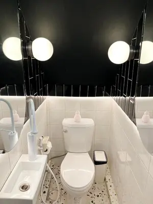 a bathroom with a white toilet and a sink at 4BR 10PAX Ensuite Near EmQuartier Emporium Emsphere in Khlong Toei