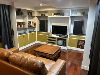 a living room with a couch and a table at The oasis on 8 3 bedrooms private zone in Bang Kapi
