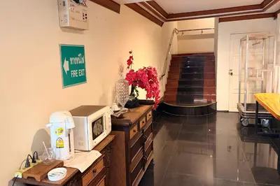 a kitchen with a microwave on top of a counter at The Grand Imperial in Ban Song Hong