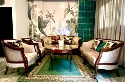 a living room with a couch and two chairs and a table at Impact Arena & DMK - 4BR 12pax Home 55