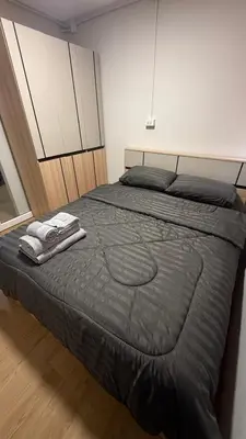 a bedroom with a large bed in a room at iMoji Stay-Room IMPACT in Ban Song Hong