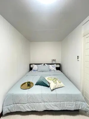 a bedroom with a large bed with a gold bowl on it at Lazy Ma-fia C3 Andy in Ban Song Hong