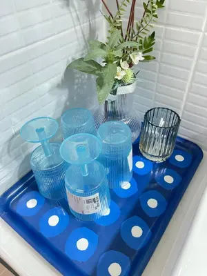 a blue tray with blue cups and a vase on it at Lazy Ma-fia C3 Andy in Ban Song Hong