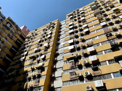 a tall apartment building with balconies on it at Lazy Ma-fia C3 Andy in Ban Song Hong
