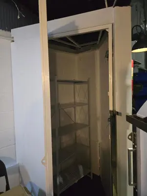 a room with a closet with a glass door at Carl and Ellie Home in Bangkok