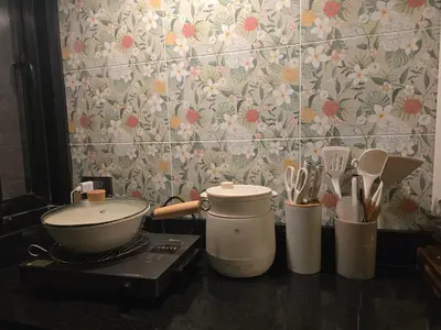 a kitchen counter with utensils and a mortar and pestle at Carl and Ellie Home in Bangkok