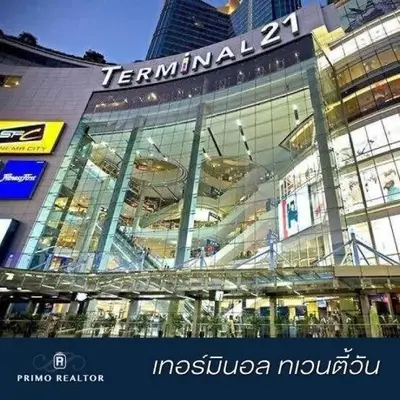 a large glass building with a sign on it at MRT-Accessible & Delightful Family Hub! in Bangkok