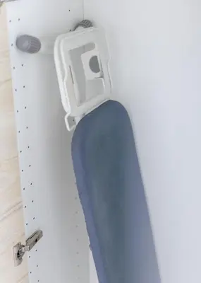 a door in a room with a blue couch at Downtown Spacious Luxury Condo BKK- 5 mins BTS! in Bangkok