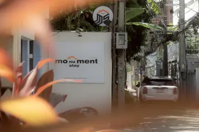 a sign that says no mot interest sixty on a street at Monument Stay in Bangkok