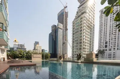 a swimming pool in a city with tall buildings at Thong Lor Luxury condo with Swimming Pool, Fast Wifi in Sathani Khlong Tan