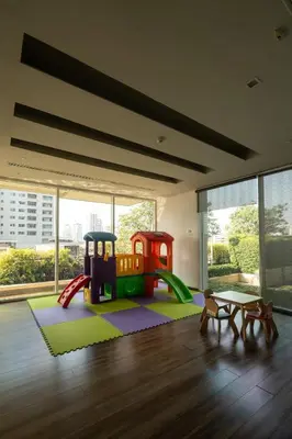 a living room with a play room with a playground at Thong Lor Luxury condo with Swimming Pool, Fast Wifi in Sathani Khlong Tan
