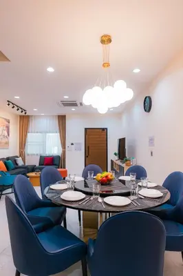 a dining room with a table and chairs at EXCLUSIVE SUKHUMVIT RESIDENCE, 3 Min BTS, Thonglor, 20 Guests in Bangkok