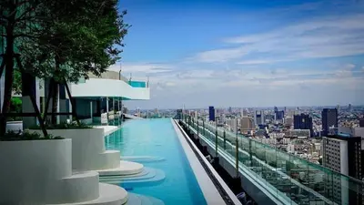 a swimming pool on the roof of a building at Life asoke rama 9 in Bangkok