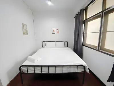 a white bed in a room with a window at xx BAO The Giant Swing - เสาชิงช้า ศาลเจ้าพ่อเสือ 1 in Bangkok