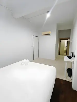 a white room with a white couch and a table at xx BAO The Giant Swing - เสาชิงช้า ศาลเจ้าพ่อเสือ 1 in Bangkok