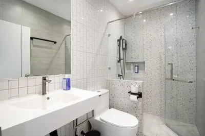 a bathroom with a sink and a toilet and a shower at Townhouse at Sathu Pradit road in Bangkok