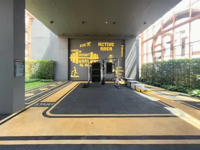 a hallway of a building with a gym at Near BTS - High-Floor - Rooftop Pool - Sontana in Bangkok