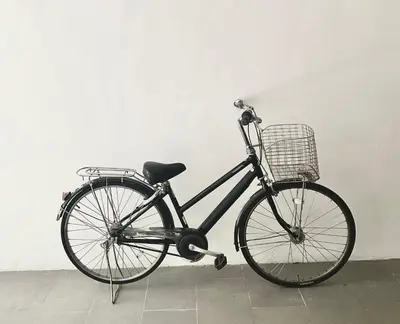 a bike with a basket parked in a room at Thong Lo 3BR Home 75in SmartTV Netflix - Quiet Home in the City Center in Bangkok