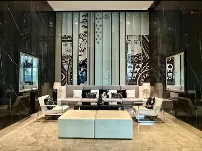 a living room with a couch and a table at Stylish Sukhumvit 36 Condo Near BTS Thonglor in Bangkok
