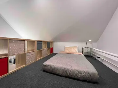 a bedroom with a large bed in a room at Crownex Studio Deluxe in Bangkok
