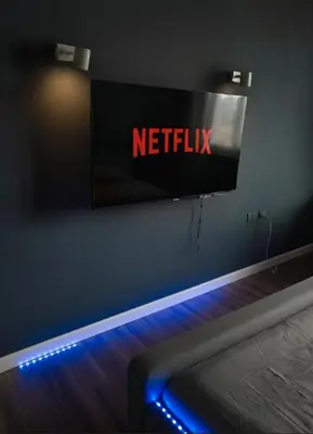 a netflix sign on a wall in a room at Omni Tower Sukhumvit Nana - Luxury Condominium in Bangkok