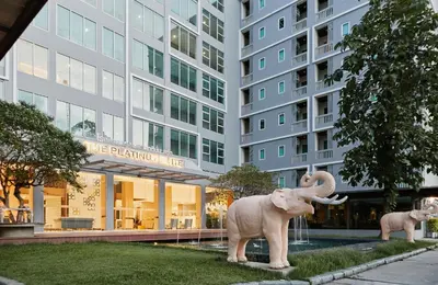 a statue of an elephant in front of a building at The Platinum Suites Bangkok by Dancenter in Bangkok