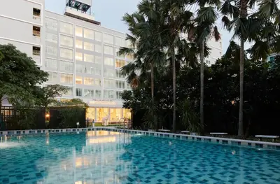 a large swimming pool in front of a building at The Platinum Suites Bangkok by Dancenter in Bangkok