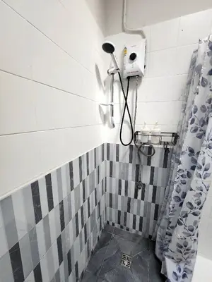 a bathroom with a shower with a shower curtain at Cozy Bangkok Townhouse for 7 Guests, 5-Minute Walk from BTS in Amphoe Phra Khanong
