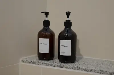 two bottles of wine sitting on a counter at Cozy Attic Retreat Chinatown near Yaowarat - Songwat in Bangkok
